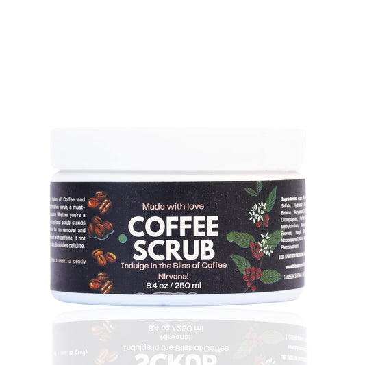 A jar of Coffee Scrub with a label that includes coffee beans and text describing the product as an exfoliator, cleanse, and hydrate for soft, smooth, and radiant skin.