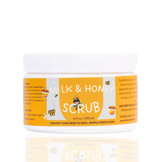 A plastic jar of TS Beauty Milk and Honey scrub with a white lid and orange label, indicating it is a coffee face and body scrub.