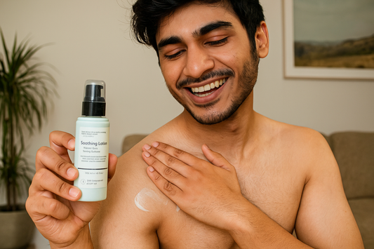 Man applying lotion to his shoulder while holding a bottle of soothing lotion.