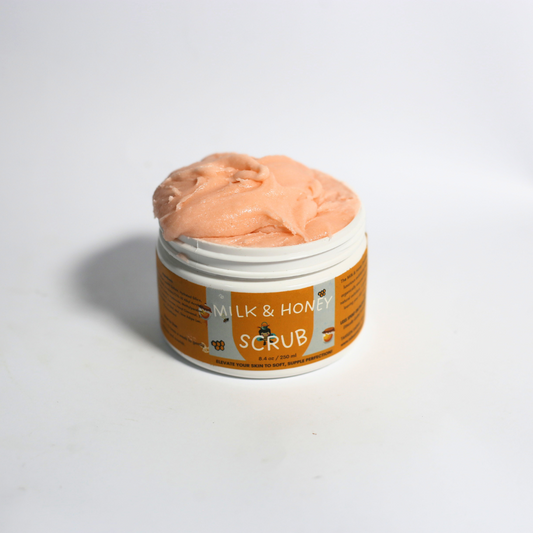 Open jar of milk and honey sugar scrub with creamy texture and golden sugar crystals