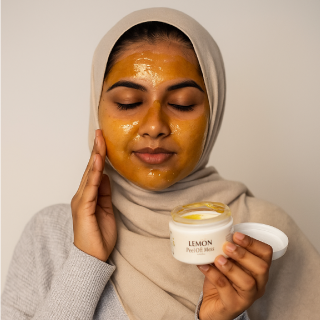 Woman applying or peeling off lemon peel-off mask from her face with a fresh, glowing look.