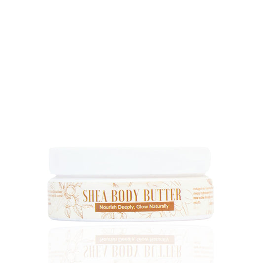 A jar of SHEA BODY BUTTER with a white lid and label that reads 'SHEA BODY BUTTER', with a decorative floral design.