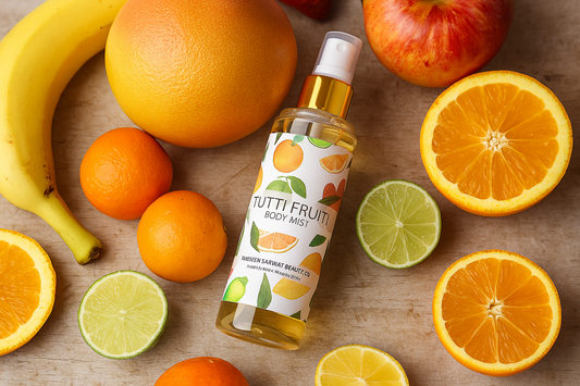 Tutti Fruity body mist bottle surrounded by fruits on a wooden surface
