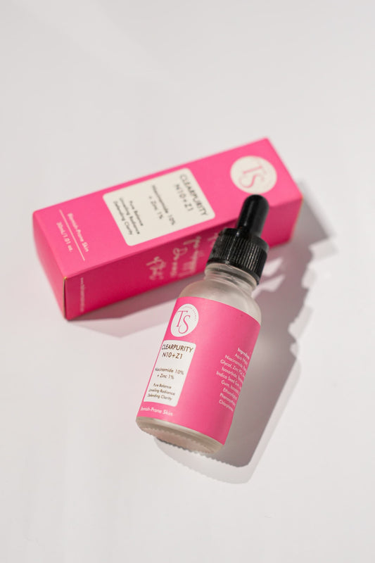 Serum bottle shown with close-up of refined skin texture and minimized pores