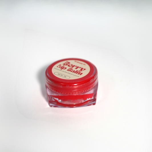 Lip balm swatch with berry-tinted color and glossy finish on lips