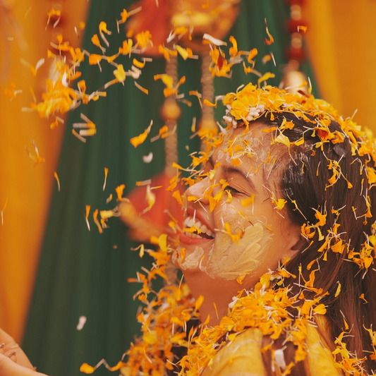 girl applying ubtan powder on face