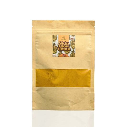 A packaged product labeled 'Skin Beauty' with a window showing the yellow ubtan powder inside.