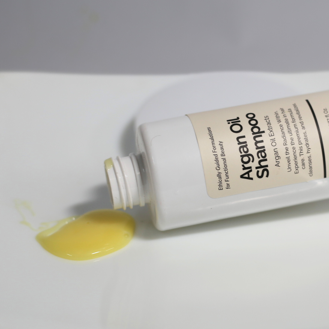 Open Argan Oil Shampoo bottle showing creamy texture or light foam.