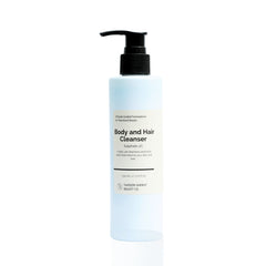 A pump bottle of Body and Hair Cleanser with a label that indicates it's a 4% Sulphate formula, suitable for daily use.
