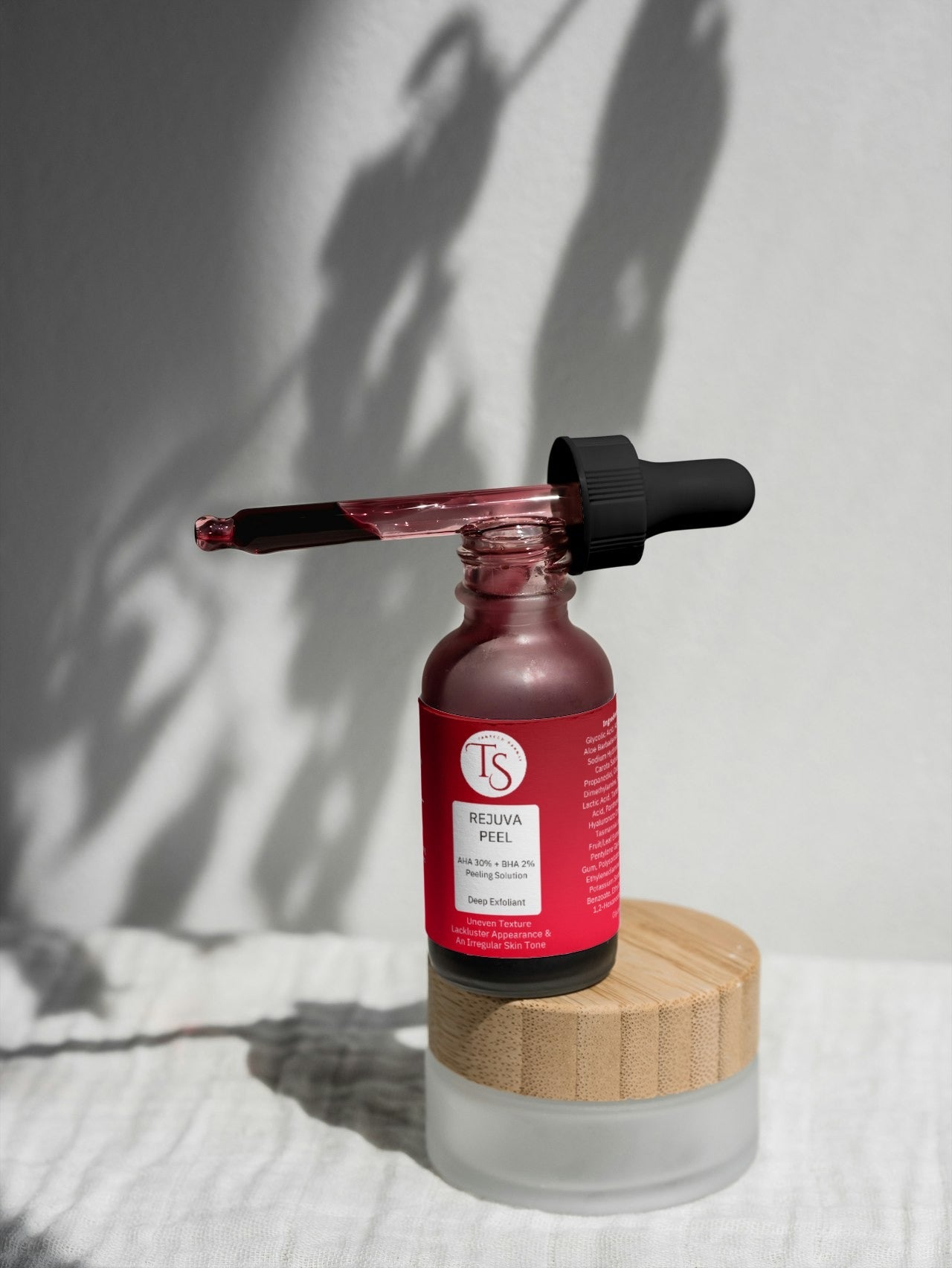 Transparent serum dropper with glowing skin background and deep pore-cleansing visuals

