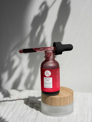 Transparent serum dropper with glowing skin background and deep pore-cleansing visuals

