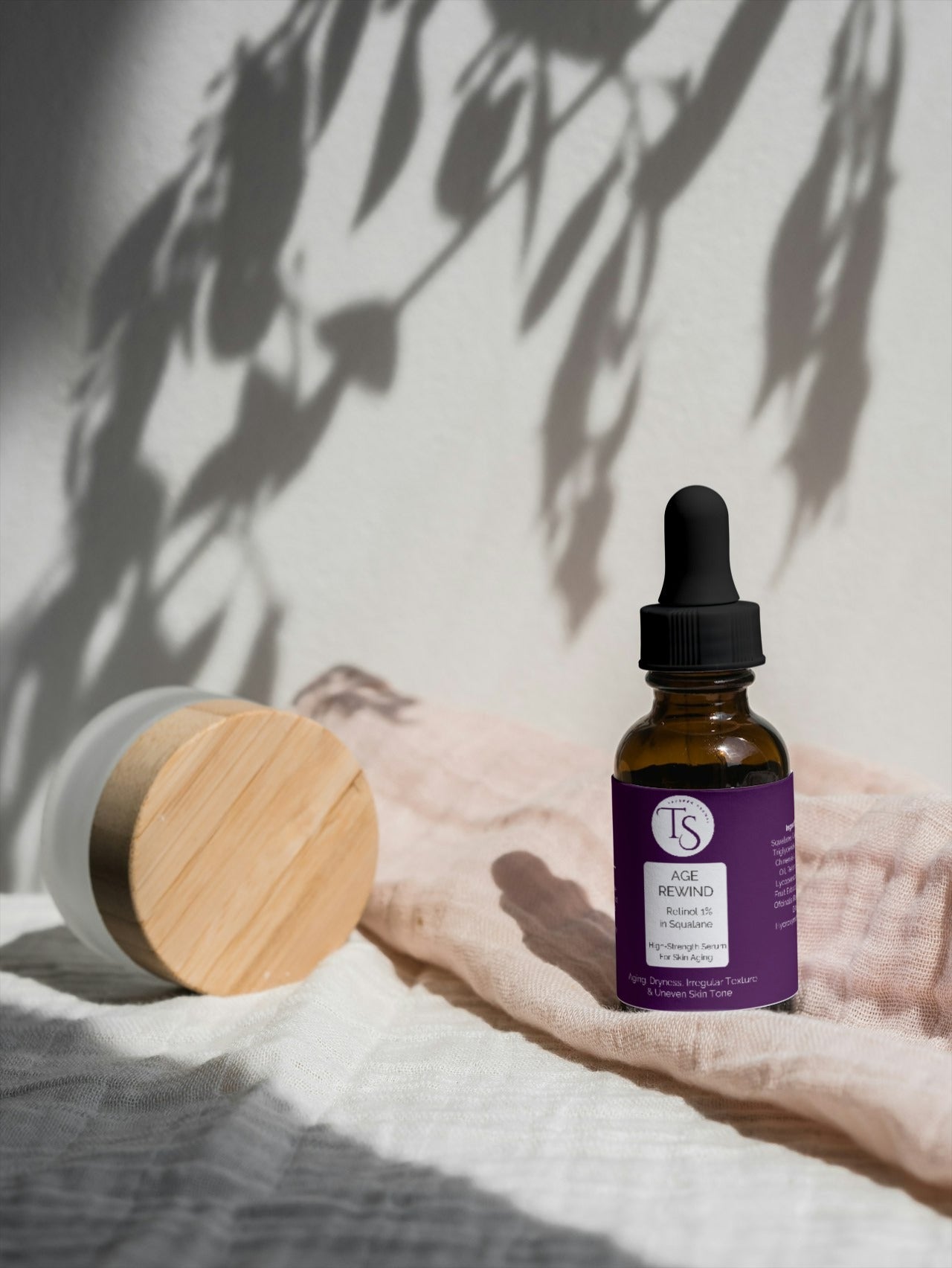 Nighttime retinol serum shown in a dark-themed flat lay with stars and moon graphics