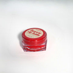  Lip balm swatch with berry-tinted color and glossy finish on lips