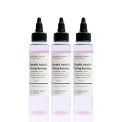 Three bottles of Glycolic Acid 7% Toning Solution on a white background